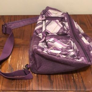 Purple patterned thirty-one crossbody bag.